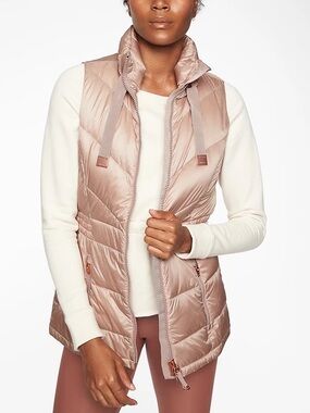 Athleta Banner Peak Down Vest in a blush with rose gold hardware - S